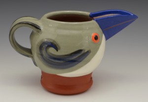 Grey jugbird with blue bill