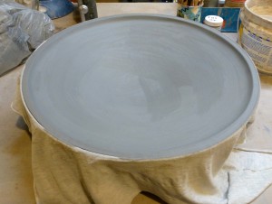 Deep platter with raised edge, 16" across at this stage