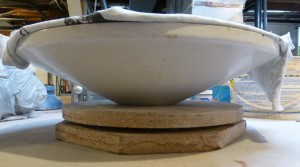 lampshade plate form, with clay slab supported with fabric